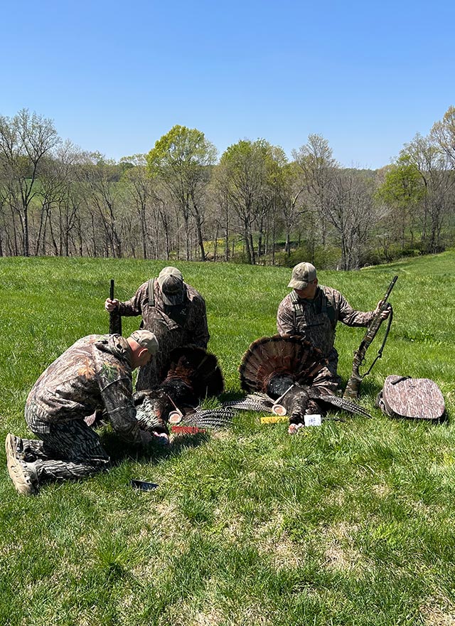 group of men turkey hunting
